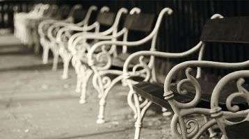 Empty chairs lined up outdoors