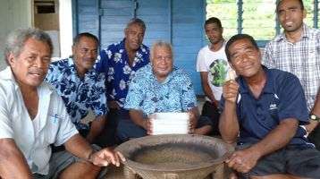 A group of Fijian men sitting around the yaqona bowl