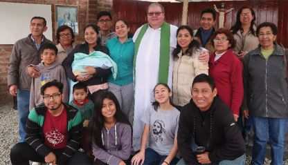 Fr. George Hogarty with the parishioners of the Sacred Heart of Jesus. 