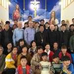 Columban Fr. Dan Troy, Fr. Thomas Greisen and Omaha Archbisop George Lucas with the bishop of Zhoucun Diocese.