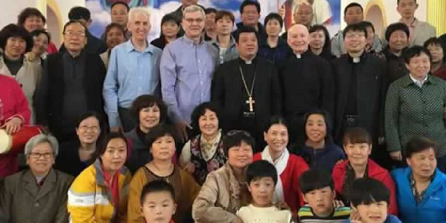 Columban Fr. Dan Troy, Fr. Thomas Greisen and Omaha Archbishop George Lucas with the bishop of Zhoucun Diocese.
