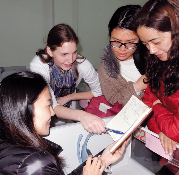 An AITECE volunteer and her students