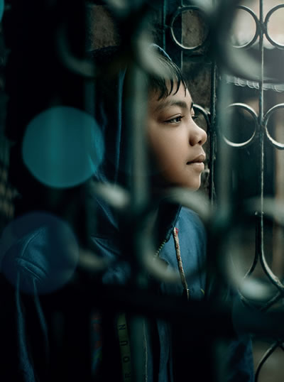 A boy looking out a window