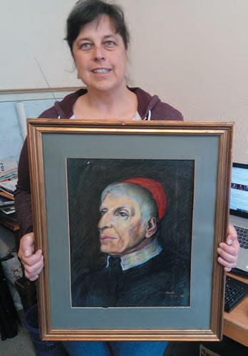 Natalie with portrait of Cardinal John Henry Newman