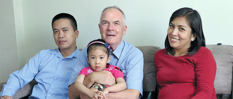 Charito, Fr. John holding Camile and Marisol in Peru