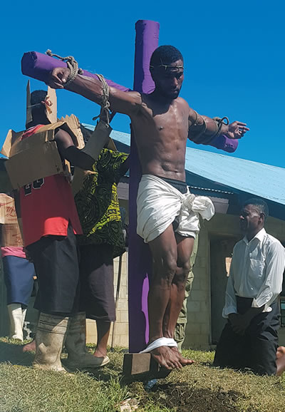 &quot;Jesus&quot; hoisted on the cross