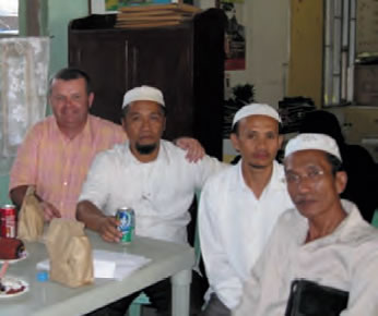 Fr. Paul Glynn with three Muslim clerics in Mindanao