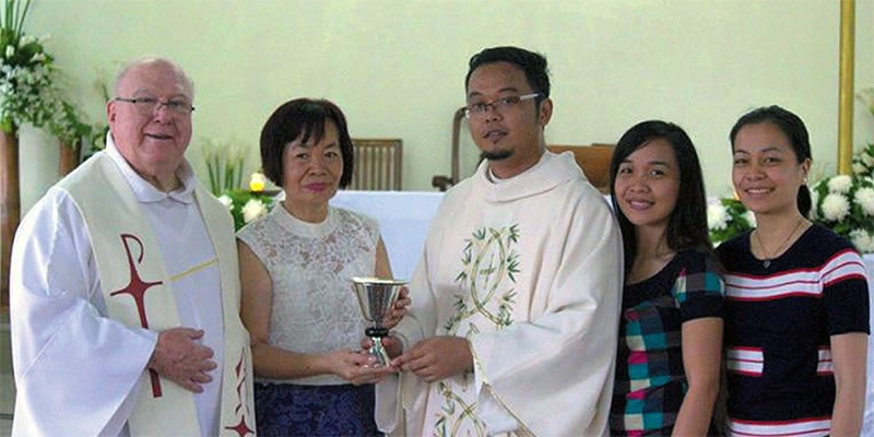 Fr. Tom (left) with Fr. Kurt at his ordination with Fr. Clarence's chalice
