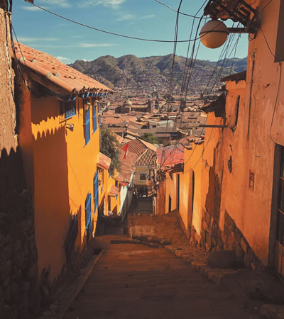 Buildings on a hillside along a street in Peru