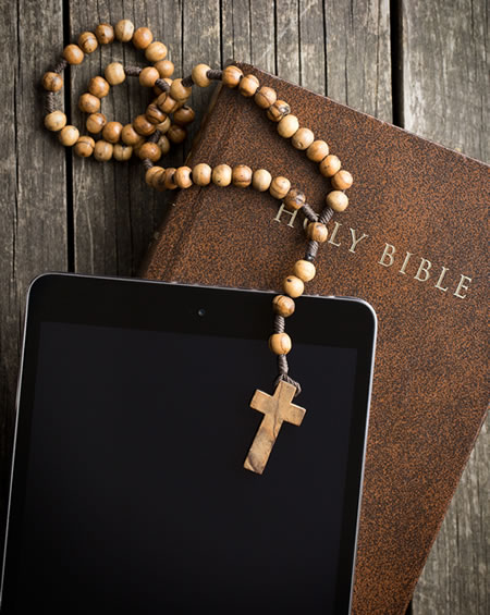 Rosary, bible and smart phone for virtual 