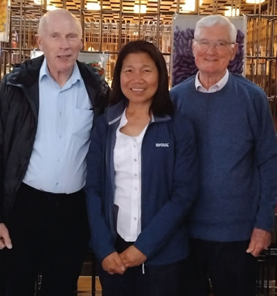 Angie (center) with Frs. Joe McDonnell and Donie Hogan , celebrating their birthdays together