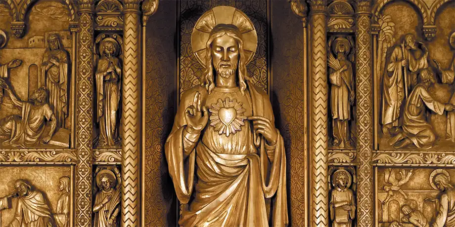 A golden statue of The Sacred Heart of Jesus
