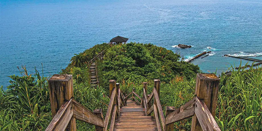 Stairs walking down a hill to the water