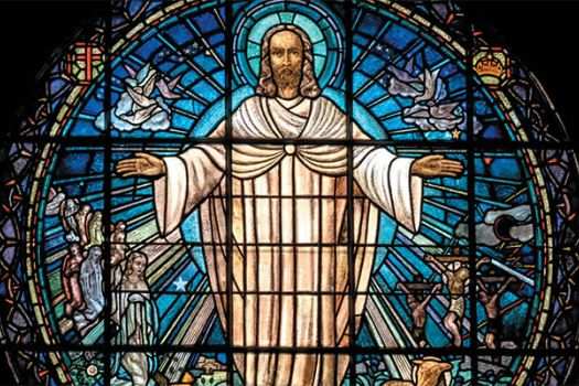 Stained glass window of risen Jesus
