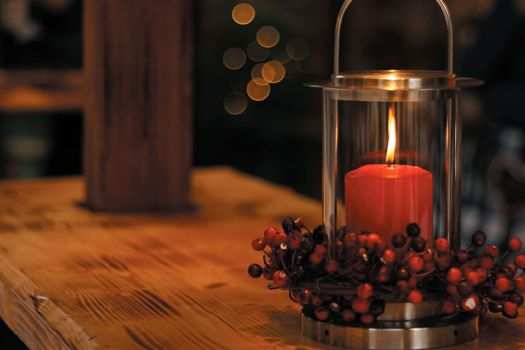 A lighted candle on a table