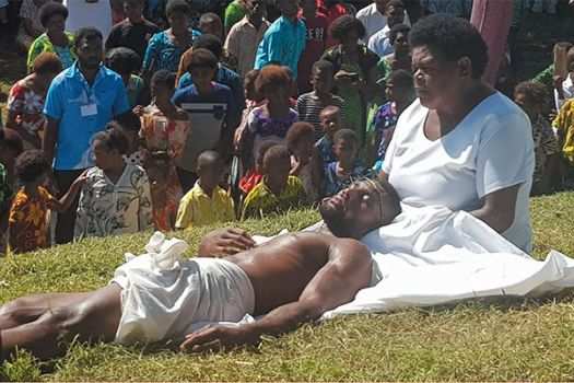 Actors portray Jesus in the arms of his mother.