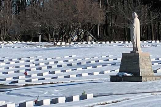 Snow blankets a cemetery 
