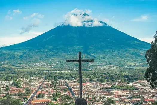 A cross overlooking the city of Livingston, Guatemala