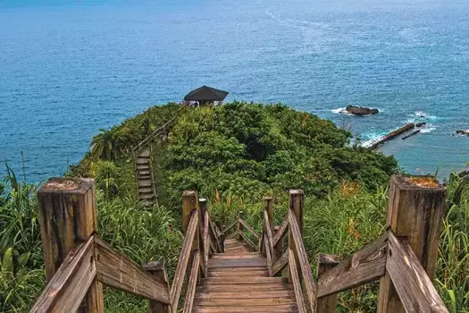 Stairs walking down a hill to the water