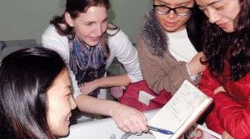 An AITECE volunteer and her students
