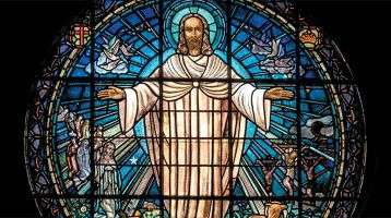 Stained glass window of risen Jesus