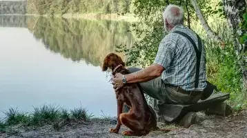 Man and dog by a lake