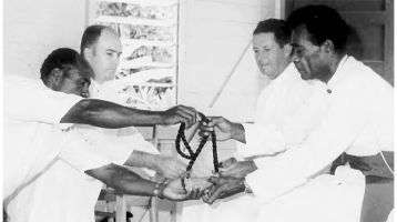 Receiving the whale tooth, the highest Fijian honor