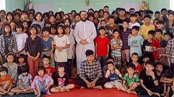 Fr. Rafael Ramirez and the students of Palana Orphanage in Myanmar
