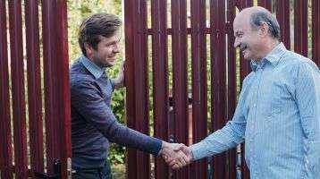 two people in a friendly handshake