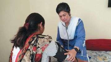 Sr. Anne on a home visitation with the sick in Pakistan.