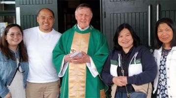 Columban lay missionary Angela Escarsa (right) with Columban Fr. Sean Coyle (center), Columban lay missionary Sherryl Lou Capili, and Sherryl’s brother and sister-in-law during a mission appeal at St. Charles Borromeo in Leixlip, Ireland