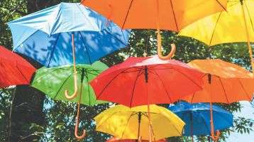 Colorful umbrellas float in the air