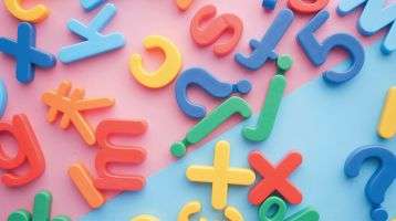 Letters, numbers and symbols on a board.