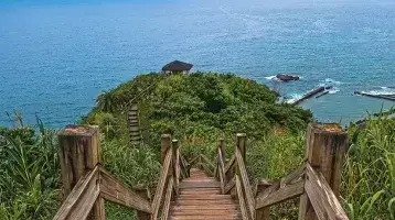 Stairs walking down a hill to the water