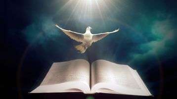 Dove over an open bible surrounded by clouds