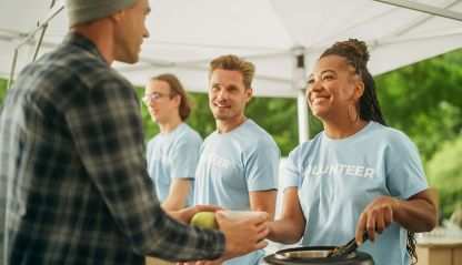 Volunteers serve food