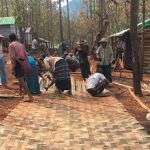 Villagers build temporary settlement