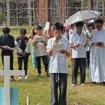 A Boy reading at one of the crosses