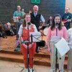 Fr. John Boles with members of the "Tongues of Fire" rock band in the Wavertree parish church