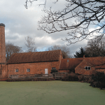Building with large smoke stack that resembles Tolkein's Sarehole Mill.