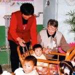 Sr. Joan working with a special needs child in China.