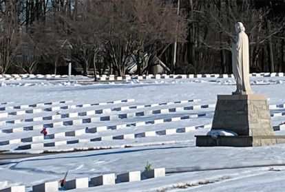Snow blankets a cemetery 