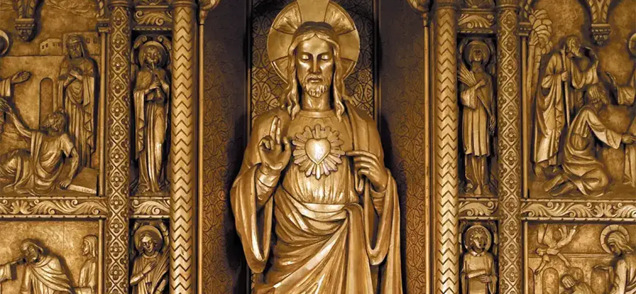 A golden statue of The Sacred Heart of Jesus