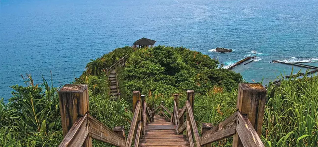 Stairs walking down a hill to the water