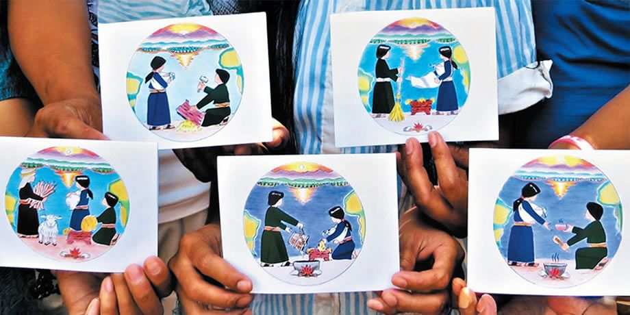 Subanen crafters holding their hand-made Christmas cards