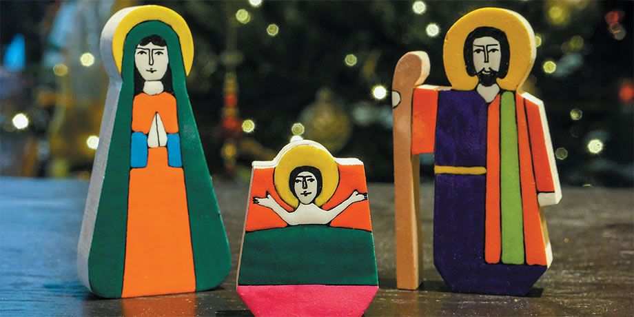 Wooden block figures of the Holy Family on a table