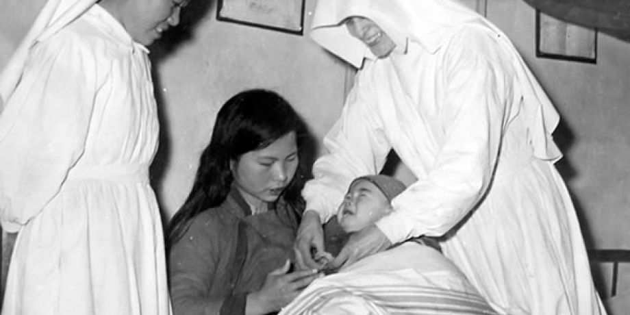 Two Sisters helping a mother with her baby in China