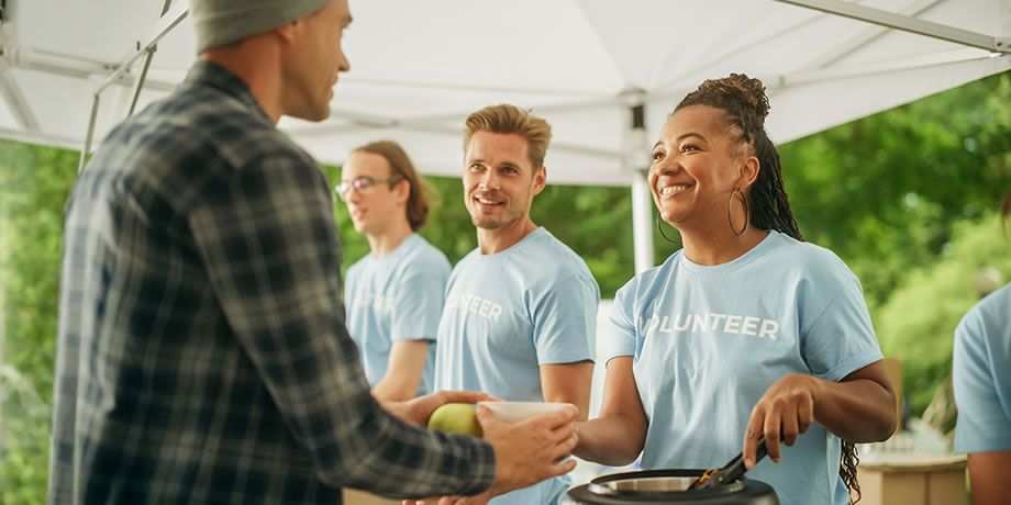 Volunteers serve food