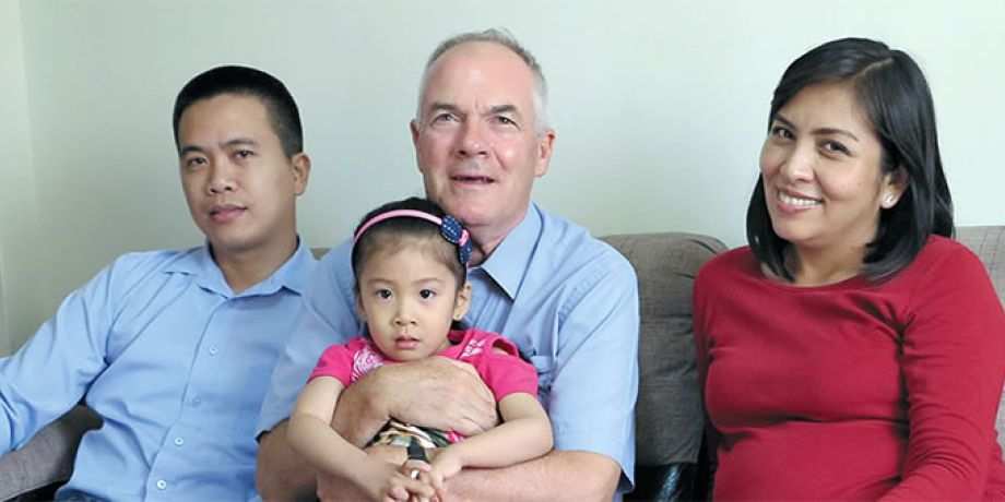 Charito, Fr. John holding Camile and Marisol in Peru