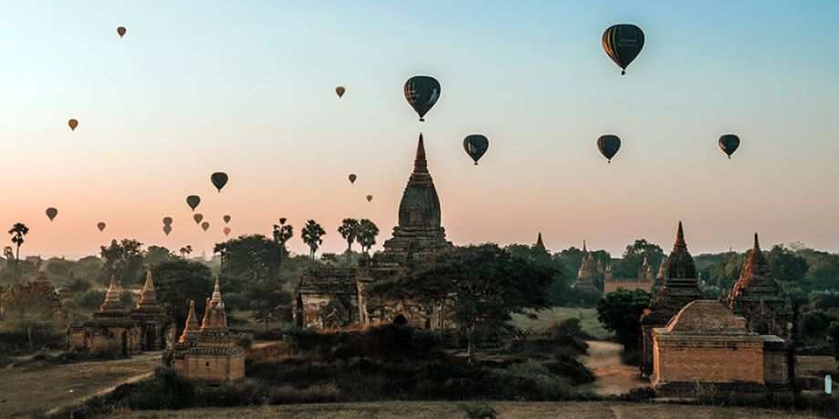 Hot air balloons fly over an ancient city in Myanmar
